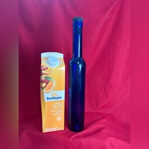 Tall narrow cobalt blue bottle